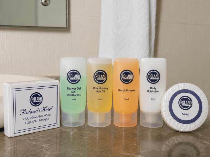 Premium room amenities at Roland Hotel Kolkata with bathroom toiletries